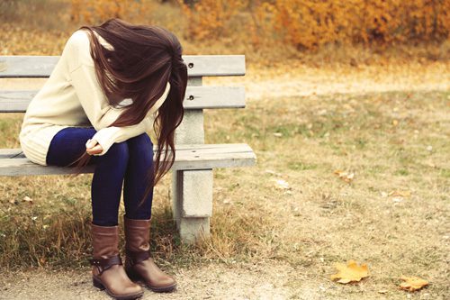 How to Know If You’ve Hit Rock Bottom - distraught girl on park bench