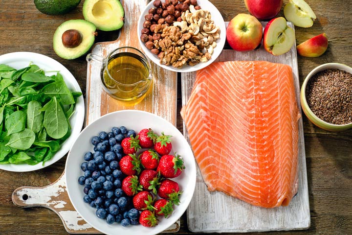 table with fruit, salmon, and avocado - nutrition