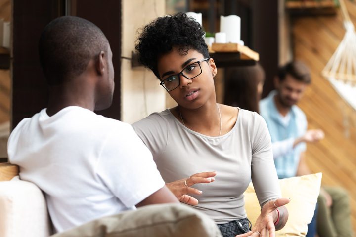 woman having conversation with man - relationships