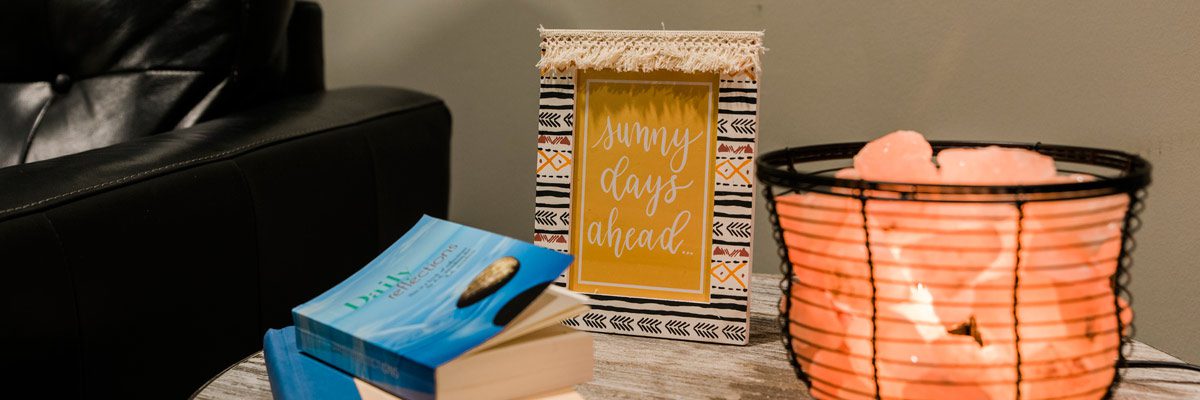 table with salt lamp and recovery books - Victory Addiction Recovery Center - Professionals Program