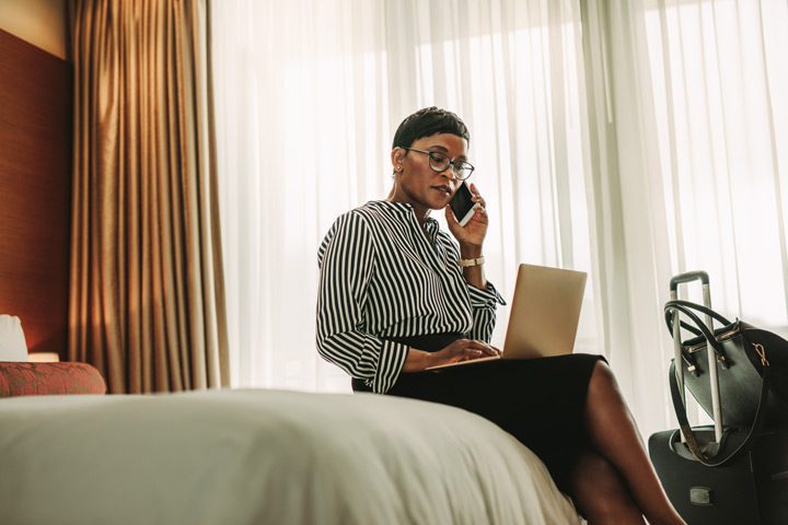 beautiful professional Black woman sitting on the edge of a bed - professionals treatment