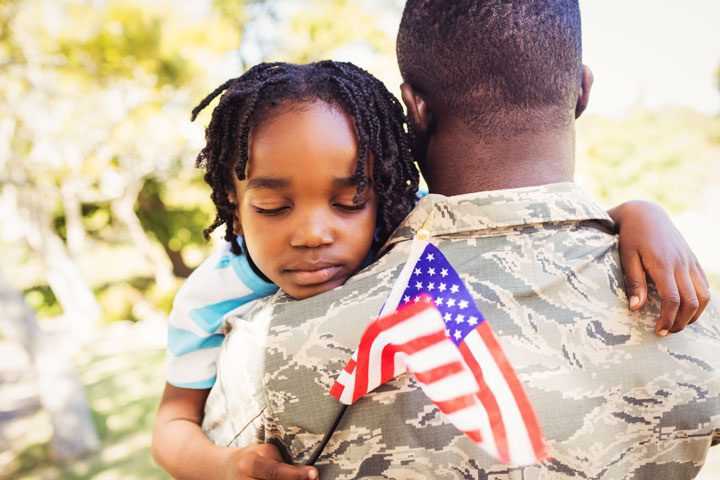 small child hugging their military father - veterans and addiction