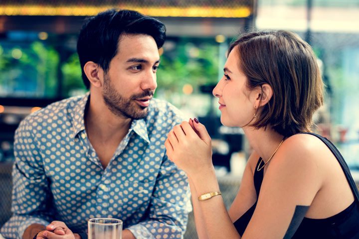attractive couple talking at a restaurant - honest